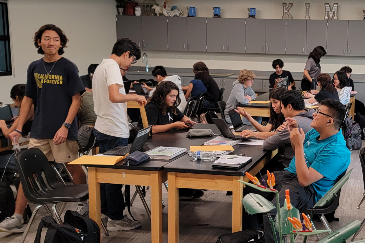 Sophomore Ryan Kim (left) interacts with his classmates Monday, Oct. 7, in the new, nearly $3.8 million building at the farm during teacher Brian Kim’s fifth period Agriculture Chemistry class in Room 201.